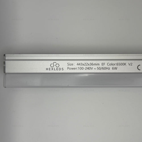 A silver aluminum LED linear light bar with black printed specifications and the HEXLEDS logo, shown against a light gray background.