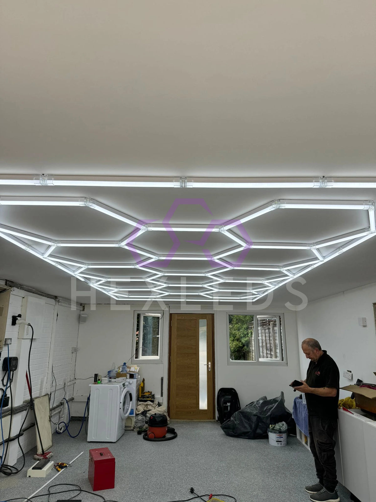 Modern interior design with geometric LED ceiling lights in a room.