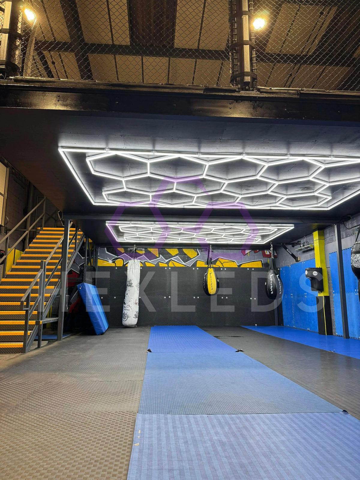 boxing gym using hex lighting fixed to a ceiling. 