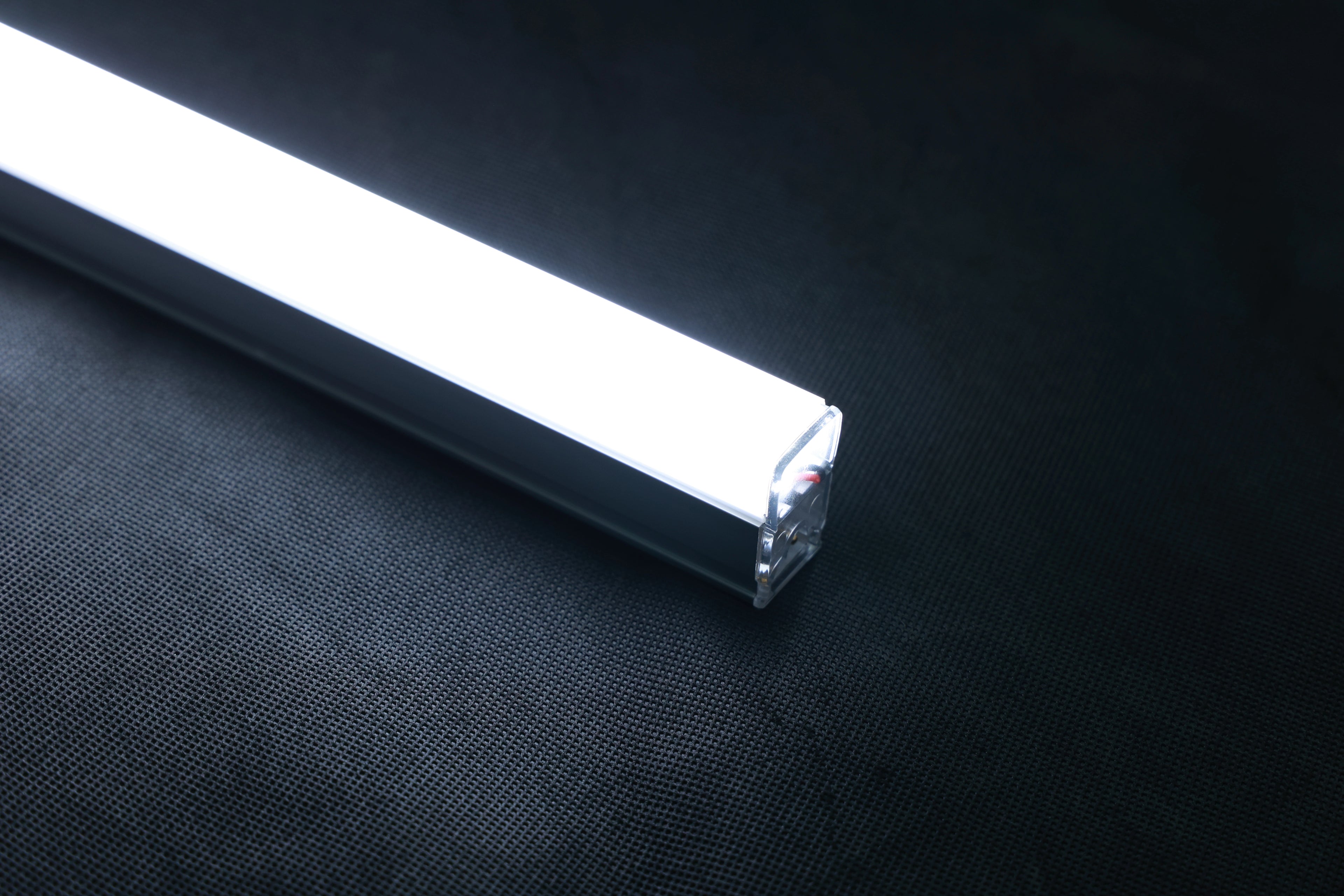 LED light bar on a dark fabric background